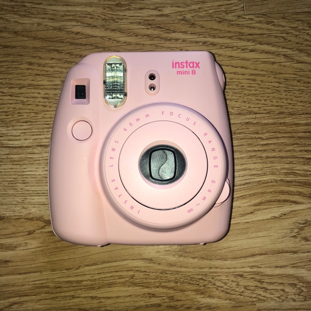 light pink fujifilm instax Polaroid camera